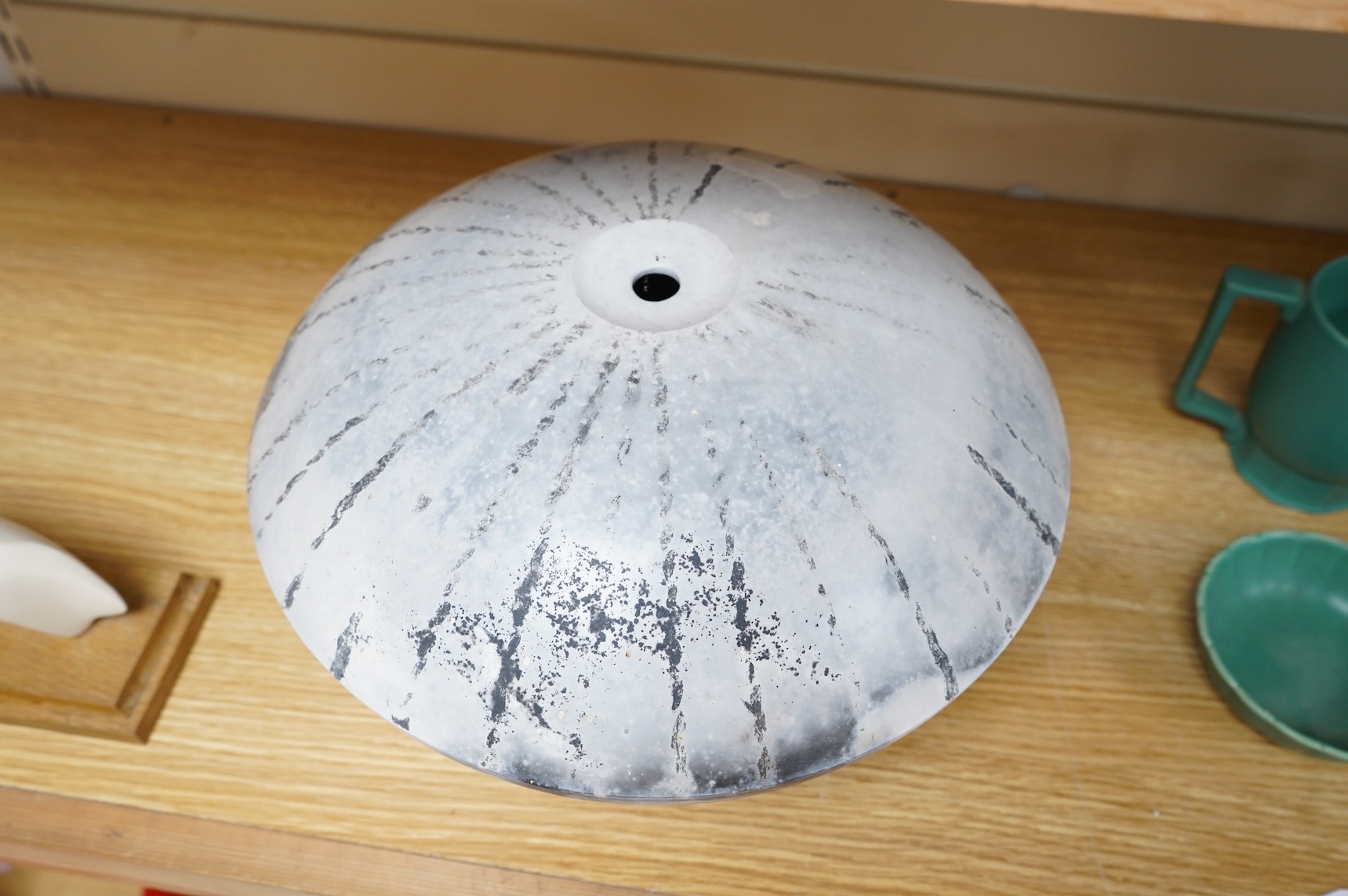 David Harrison (Modern British) a pit fired pottery vase of circular squat form, incised initials to the base, 31cm in diameter